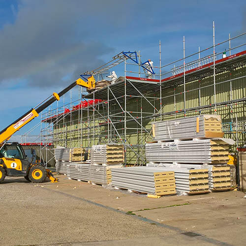 A telehandler used to unload and crane into position on the roof to reduce manual handling Independent platform scaffold complete with strategically placed loading bays. All complying with structural loading calculations and to HSE Recommendations and NFRC 33 regulation r (see above)
