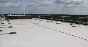 New insulated single ply roof installed by Belmont Roofing for City College complete with a permanent fall restraint system.